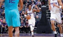 SACRAMENTO, CA - JANUARY 2: De'Aaron Fox #5 of the Sacramento Kings handles the ball against the Charlotte Hornets on January 2, 2018 at Golden 1 Center in Sacramento, California. NOTE TO USER: User expressly acknowledges and agrees that, by downloading and or using this Photograph, user is consenting to the terms and conditions of the Getty Images License Agreement. Mandatory Copyright Notice: Copyright 2018 NBAE