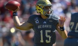 PALO ALTO, CA - SEPTEMBER 15: Jake Maier #15 of the UC Davis Aggies drops back to pass against the Stanford Cardinal during the first quarter of an NCAA football game at Stanford Stadium on September 15, 2018 in Palo Alto, California.