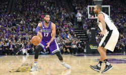 SACRAMENTO, CA - OCTOBER 27: Garrett Temple #17 of the Sacramento Kings passes the ball by Tony Parker #9 of the San Antonio Spurs during the first quarter of an NBA basketball game at Golden 1 Center on October 27, 2016 in Sacramento, California. NOTE TO USER: User expressly acknowledges and agrees that, by downloading and or using this photograph, User is consenting to the terms and conditions of the Getty Images License Agreement. (Photo by Thearon W. Henderson/Getty Images)