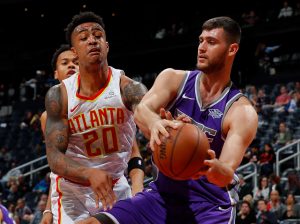 ATLANTA, GA - NOVEMBER 15: Georgios Papagiannis #13 of the Sacramento Kings grabs this rebound against John Collins #20 of the Atlanta Hawks at Philips Arena on November 15, 2017 in Atlanta, Georgia. NOTE TO USER: User expressly acknowledges and agrees that, by downloading and or using this photograph, User is consenting to the terms and conditions of the Getty Images License Agreement. (Photo by Kevin C. Cox/Getty Images)