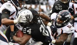 OAKLAND, CA - NOVEMBER 26: Marshawn Lynch #24 of the Oakland Raiders rushes for a touchdown against the Denver Broncos during their NFL game at Oakland-Alameda County Coliseum on November 26, 2017 in Oakland, California. (Photo by Robert Reiners/Getty Images)