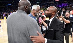 LOS ANGELES, CA - DECEMBER 18: NBA legends Bill Russell and Shaquille O'Neal shake hands with Kobe Bryant at halftime after both of Bryant's #8 and #24 Los Angeles Lakers jerseys are retired at Staples Center on December 18, 2017 in Los Angeles, California. NOTE TO USER: User expressly acknowledges and agrees that, by downloading and or using this photograph, User is consenting to the terms and conditions of the Getty Images License Agreement. (Photo by Kevork Djansezian/Getty Images)