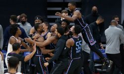 SACRAMENTO, CALIFORNIA - MARCH 27: Harrison Barnes #40 of the Sacramento Kings celebrates with teammates after making a three point shot to win the game against the Cleveland Cavaliers at Golden 1 Center on March 27, 2021 in Sacramento, California. NOTE TO USER: User expressly acknowledges and agrees that, by downloading and or using this photograph, User is consenting to the terms and conditions of the Getty Images License Agreement. (Photo by Lachlan Cunningham/Getty Images)