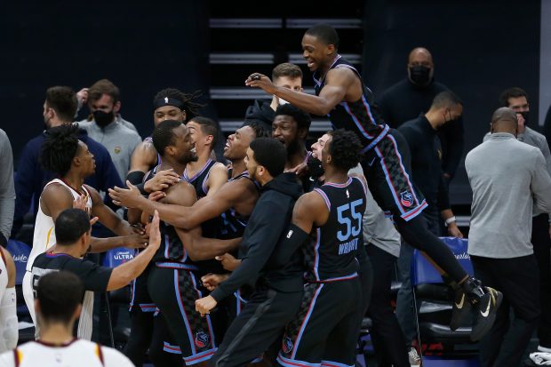 SACRAMENTO, CALIFORNIA - MARCH 27: Harrison Barnes #40 of the Sacramento Kings celebrates with teammates after making a three point shot to win the game against the Cleveland Cavaliers at Golden 1 Center on March 27, 2021 in Sacramento, California. NOTE TO USER: User expressly acknowledges and agrees that, by downloading and or using this photograph, User is consenting to the terms and conditions of the Getty Images License Agreement. (Photo by Lachlan Cunningham/Getty Images)