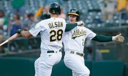 OAKLAND, CALIFORNIA - JUNE 29: Matt Chapman #26 of the Oakland Athletics celebrates with Matt Olson #28 after hitting a solo home run in the bottom of the first inning against the Texas Rangers at RingCentral Coliseum on June 29, 2021 in Oakland, California. (Photo by Lachlan Cunningham/Getty Images)