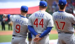 ARLINGTON, TX - MARCH 28: Javier Baez #9, Anthony Rizzo #44 and Kris Bryant #17 of the Chicago Cubs are seen during player introductions before the game between the Chicago Cubs and the Texas Rangers at Globe Life Park in Arlington on Thursday, March 28, 2019 in Arlington, Texas. (Photo by Cooper Neill/MLB via Getty Images)