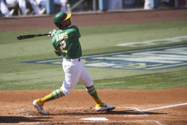 LOS ANGELES, CA - OCTOBER 06: Khris Davis #2 of the Oakland Athletics hits a solo home run in the second inning during Game 2 of the ALDS between the Houston Astros and the Oakland Athletics at Dodger Stadium on Tuesday, October 6, 2020 in Los Angeles, California. (Photo by Rob Leiter/MLB Photos via Getty Images)