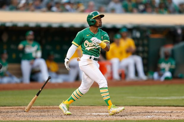 OAKLAND, CALIFORNIA - AUGUST 29: Tony Kemp #5 of the Oakland Athletics hits a two-run home run in the bottom of the eighth inning against the New York Yankees at RingCentral Coliseum on August 29, 2021 in Oakland, California. (Photo by Lachlan Cunningham/Getty Images)