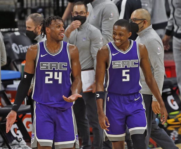 SAN ANTONIO, TX - MARCH 29: Buddy Hield #24 of the Sacramento Kings and De'Aaron Fox #5 share a moment during closing minute of play against the San Antonio Spurs in the second half at AT&T Center on March 29, 2021 in San Antonio, Texas. Sacramento Kings defeated the San Antonio Spurs 132-115. NOTE TO USER: User expressly acknowledges and agrees that , by downloading and or using this photograph, User is consenting to the terms and conditions of the Getty Images License Agreement. (Photo by Ronald Cortes/Getty Images)