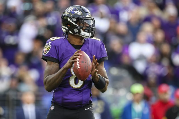 BALTIMORE, MD - NOVEMBER 07: Lamar Jackson #8 of the Baltimore Ravens looks to pass against the Minnesota Vikings during the second half at M&T Bank Stadium on November 7, 2021 in Baltimore, Maryland. (Photo by Scott Taetsch/Getty Images)"nNo licensing by any casino, sportsbook, and/or fantasy sports organization for any purpose. During game play, no use of images within play-by-play, statistical account or depiction of a game (e.g., limited to use of fewer than 10 images during the game)