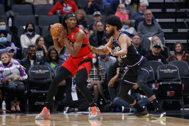 SACRAMENTO, CALIFORNIA - NOVEMBER 19: Precious Achiuwa #5 of the Toronto Raptors is guarded by Marvin Bagley III #35 of the Sacramento Kings in the first quarter at Golden 1 Center on November 19, 2021 in Sacramento, California. NOTE TO USER: User expressly acknowledges and agrees that, by downloading and/or using this photograph, User is consenting to the terms and conditions of the Getty Images License Agreement. (Photo by Lachlan Cunningham/Getty Images)