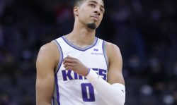 SACRAMENTO, CALIFORNIA - NOVEMBER 22: Tyrese Haliburton #0 of the Sacramento Kings looks on against the Philadelphia 76ers during the second half of an NBA basketball game at Golden 1 Center on November 22, 2021 in Sacramento, California. NOTE TO USER: User expressly acknowledges and agrees that, by downloading and or using this photograph, User is consenting to the terms and conditions of the Getty Images License Agreement. (Photo by Thearon W. Henderson/Getty Images)