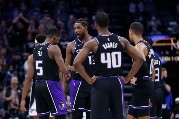 SACRAMENTO, CALIFORNIA - DECEMBER 08: Sacramento Kings players talk during a break in play in the fourth quarter against the Orlando Magic at Golden 1 Center on December 08, 2021 in Sacramento, California. NOTE TO USER: User expressly acknowledges and agrees that, by downloading and/or using this photograph, User is consenting to the terms and conditions of the Getty Images License Agreement. (Photo by Lachlan Cunningham/Getty Images)