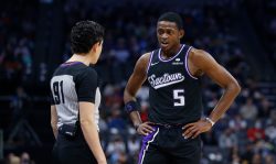 SACRAMENTO, CALIFORNIA - DECEMBER 26: De'Aaron Fox #5 of the Sacramento Kings talks to referee Cheryl Flores #91 during the game against the Memphis Grizzlies at Golden 1 Center on December 26, 2021 in Sacramento, California. NOTE TO USER: User expressly acknowledges and agrees that, by downloading and/or using this photograph, User is consenting to the terms and conditions of the Getty Images License Agreement. (Photo by Lachlan Cunningham/Getty Images)