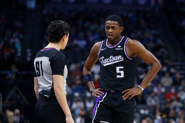 SACRAMENTO, CALIFORNIA - DECEMBER 26: De'Aaron Fox #5 of the Sacramento Kings talks to referee Cheryl Flores #91 during the game against the Memphis Grizzlies at Golden 1 Center on December 26, 2021 in Sacramento, California. NOTE TO USER: User expressly acknowledges and agrees that, by downloading and/or using this photograph, User is consenting to the terms and conditions of the Getty Images License Agreement. (Photo by Lachlan Cunningham/Getty Images)
