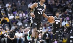 SACRAMENTO, CALIFORNIA - JANUARY 12: Buddy Hield #24 of the Sacramento Kings dribbles the ball up court against the Los Angeles Lakers during the first quarter at Golden 1 Center on January 12, 2022 in Sacramento, California. NOTE TO USER: User expressly acknowledges and agrees that, by downloading and or using this photograph, User is consenting to the terms and conditions of the Getty Images License Agreement. (Photo by Thearon W. Henderson/Getty Images)