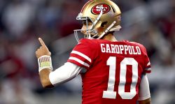 ARLINGTON, TEXAS - JANUARY 16: Jimmy Garoppolo #10 of the San Francisco 49ers reacts during the third quarter against the Dallas Cowboys in the NFC Wild Card Playoff game at AT&T Stadium on January 16, 2022 in Arlington, Texas.