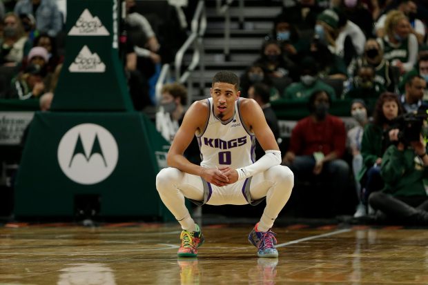 MILWAUKEE, WISCONSIN - JANUARY 22: Tyrese Haliburton #0 of the Sacramento Kings takes a break during the second half of the game against the Milwaukee Bucks at Fiserv Forum on January 22, 2022 in Milwaukee, Wisconsin. Bucks defeated the Kings 133-127. NOTE TO USER: User expressly acknowledges and agrees that, by downloading and or using this photograph, User is consenting to the terms and conditions of the Getty Images License Agreement. (Photo by John Fisher/Getty Images)