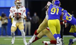 INGLEWOOD, CALIFORNIA - JANUARY 30: Jimmy Garoppolo #10 of the San Francisco 49ers looks to pass the ball in the NFC Championship Game against the Los Angeles Rams at SoFi Stadium on January 30, 2022 in Inglewood, California. (Photo by Ronald Martinez/Getty Images)