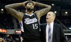 SACRAMENTO, CA - NOVEMBER 01: Head Coach Michael Malone grabs DeMarcus Cousins #15 of the Sacramento Kings after Cousins was called for a technical foul during the fourth quarter against the Los Angeles Clippers at Sleep Train Arena on November 1, 2013 in Sacramento, California. NOTE TO USER: User expressly acknowledges and agrees that, by downloading and or using this photograph, User is consenting to the terms and conditions of the Getty Images License Agreement. The Clippers won the game 110-101. (Photo by Thearon W. Henderson/Getty Images)