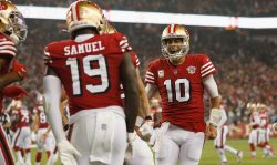 SANTA CLARA, CALIFORNIA - NOVEMBER 15: Deebo Samuel #19 of the San Francisco 49ers celebrates with quarterback Jimmy Garoppolo #10 after scoring a touchdown in the fourth quarter against the Los Angeles Rams at Levi's Stadium on November 15, 2021 in Santa Clara, California. (Photo by Lachlan Cunningham/Getty Images)