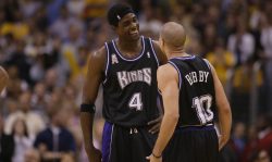 LOS ANGELES - MAY 31: Chris Webber #4 smiles with Mike Bibby #10 of the Sacramento Kings in Game six of the Western Conference Finals during the 2002 NBA Playoffs against the Los Angeles Lakers on May 31, 2002 at Staples Center in Los Angeles, California. The Lakers won 106-102. NOTE TO USER: User expressly acknowledges and agrees that, by downloading and/or using this Photograph, User is consenting to the terms and conditions of the Getty Images License Agreement. (Photo by Jed Jacobsohn/Getty Images)